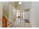 Inviting foyer with high ceilings, staircase, and views into the living room, creating a welcoming entrance at 10733 Salida St, Commerce City, CO 80022