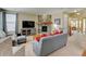 Cozy living room with stone fireplace, media center, and plush seating, perfect for relaxation at 10733 Salida St, Commerce City, CO 80022