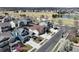 Street view with well-maintained homes, sidewalks, and blooming trees, presenting a welcoming neighborhood environment at 10733 Salida St, Commerce City, CO 80022