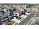 Street view with colorful homes, sidewalks, and blooming trees, presenting a vibrant neighborhood environment at 10733 Salida St, Commerce City, CO 80022
