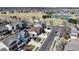 Street view with well-maintained homes, sidewalks, and blooming trees, presenting a welcoming neighborhood environment at 10733 Salida St, Commerce City, CO 80022