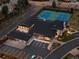 Aerial view of clubhouse, tennis courts, and parking lots at 2552 E Alameda Ave # 32, Denver, CO 80209
