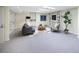 Cozy finished basement with built-in shelving, modern furniture, and comfortable living space at 2552 E Alameda Ave # 32, Denver, CO 80209
