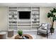 Basement built-ins and cabinets provide display shelving for furniture, décor and entertainment at 2552 E Alameda Ave # 32, Denver, CO 80209