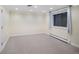 Spacious basement area featuring neutral carpeting, a window for natural light, and a clean, versatile space at 2552 E Alameda Ave # 32, Denver, CO 80209