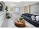 Comfortable finished basement with modern furnishings, area rug, and ample space for entertainment at 2552 E Alameda Ave # 32, Denver, CO 80209