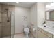 Modern bathroom featuring glass walk-in shower, modern fixtures, and neutral-toned tiles at 2552 E Alameda Ave # 32, Denver, CO 80209