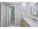 Bright bathroom with marble floors, and a view into tub area at 2552 E Alameda Ave # 32, Denver, CO 80209
