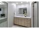Elegant bathroom featuring marble countertops, stylish fixtures, and a view into adjoining bath and tub at 2552 E Alameda Ave # 32, Denver, CO 80209