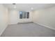 Bright bedroom featuring neutral walls, a window for natural light, and baseboard heating at 2552 E Alameda Ave # 32, Denver, CO 80209