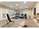 Community fitness center with treadmills, stationary bike, and weightlifting equipment at 2552 E Alameda Ave # 32, Denver, CO 80209