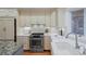 Modern kitchen boasting stainless steel oven, sleek countertops, and ample cabinet space for storage at 2552 E Alameda Ave # 32, Denver, CO 80209