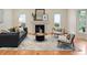 Cozy living room featuring a fireplace, hardwood floors, and stylish furnishings for comfortable living at 2552 E Alameda Ave # 32, Denver, CO 80209