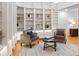Cozy living room features a large built-in bookshelf and comfortable seating arrangement at 2552 E Alameda Ave # 32, Denver, CO 80209