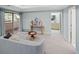 Bright bedroom with access to balcony, seating area and en-suite bath at 2552 E Alameda Ave # 32, Denver, CO 80209