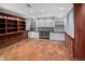 Office space with decorative flooring, built-in shelving, cabinets, and desk space at 2552 E Alameda Ave # 32, Denver, CO 80209