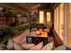Covered patio featuring comfortable seating and a brick floor for outdoor relaxation and entertainment at 2552 E Alameda Ave # 32, Denver, CO 80209