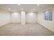 Unfinished basement with light grey carpet, white walls and recessed lighting at 1870 Alpine Dr, Erie, CO 80516