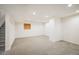 Unfinished basement with light grey carpet, white walls and recessed lighting and stairs at 1870 Alpine Dr, Erie, CO 80516