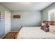 This is a bedroom with carpeted floor, white walls, and a wooden bed frame at 1870 Alpine Dr, Erie, CO 80516