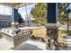 Charming front porch features a swing, stone pillars, and a cozy, inviting atmosphere at 1870 Alpine Dr, Erie, CO 80516