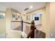 Hallway on the second story of a home featuring hardwood floors and a white banister at 1870 Alpine Dr, Erie, CO 80516