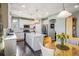 Bright kitchen with a center island, breakfast nook, stainless steel appliances, and white cabinets creates a functional design at 1870 Alpine Dr, Erie, CO 80516