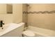 Modern bathroom features a sleek vanity, bathtub, and updated fixtures at 8627 Santa Fe Dr, Thornton, CO 80260