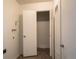 Hallway featuring closet access and tiled flooring at 8627 Santa Fe Dr, Thornton, CO 80260