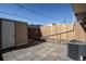 A fenced patio area with pavers and an exterior access door at 8627 Santa Fe Dr, Thornton, CO 80260