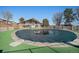 Community pool area with covered pool and surrounding fence and deck at 8627 Santa Fe Dr, Thornton, CO 80260