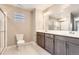 Spacious bathroom with double sinks, ample counter space and glass enclosed shower at 764 N Quatar St, Aurora, CO 80018