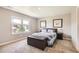 Cozy bedroom with a full bed, leather storage bench, and neutral decor at 764 N Quatar St, Aurora, CO 80018