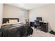 Functional bedroom with desk, chair, and bed illuminated by natural light at 764 N Quatar St, Aurora, CO 80018