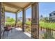 Charming front porch featuring stone columns and views of the community at 764 N Quatar St, Aurora, CO 80018