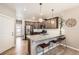 Modern kitchen featuring granite countertops, stainless steel appliances, and a breakfast bar at 764 N Quatar St, Aurora, CO 80018