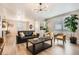 Cozy living room featuring hardwood floors, modern lighting, and comfortable seating at 764 N Quatar St, Aurora, CO 80018