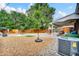 Spacious backyard featuring a basketball court, volleyball net, and covered patio at 61 S 17Th Avdr, Brighton, CO 80601