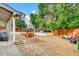 Cozy backyard with a picnic table under an umbrella, perfect for outdoor dining at 61 S 17Th Avdr, Brighton, CO 80601