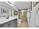 Well-lit bathroom with a vanity, a shower with glass doors, and modern fixtures at 61 S 17Th Avdr, Brighton, CO 80601