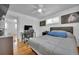 Comfortable bedroom features neutral tones, a ceiling fan, and a nearby workspace at 61 S 17Th Avdr, Brighton, CO 80601