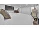 Neutral Primary bedroom features tv, dresser and closet with white walls at 61 S 17Th Avdr, Brighton, CO 80601
