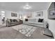 Spacious living room features comfortable seating, neutral tones, and wall decor at 61 S 17Th Avdr, Brighton, CO 80601
