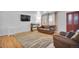 Open-concept living area with hardwood floors, providing a comfortable and stylish space at 61 S 17Th Avdr, Brighton, CO 80601