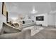 Inviting living room featuring cozy seating, a large television, and warm lighting at 61 S 17Th Avdr, Brighton, CO 80601