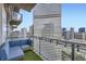 Cozy balcony with artificial turf, seating, string lights, and stunning city views at 2001 Lincoln St # 2213, Denver, CO 80202