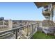 Stunning city view from the condo balcony with outdoor seating and modern glass railings at 2001 Lincoln St # 2213, Denver, CO 80202