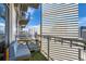 Spacious balcony with glass railings offering panoramic views of the surrounding city at 2001 Lincoln St # 2213, Denver, CO 80202