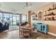 Bright dining area featuring a distressed wood table and unique shelving at 2001 Lincoln St # 2213, Denver, CO 80202