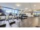 Well-equipped fitness center with treadmills, ellipticals, and floor-to-ceiling windows at 2001 Lincoln St # 2213, Denver, CO 80202